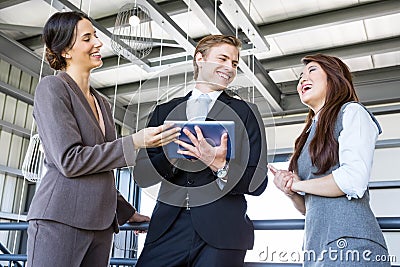 Three colleagues discussing in office Stock Photo