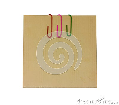 Three colored paper clips with blank notepaper. Sheet for your message or adding more text. Memo note with paper clips Stock Photo