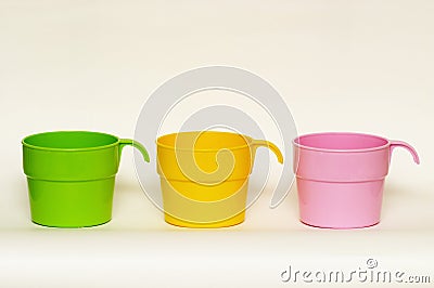 Three colored plastic cups Stock Photo