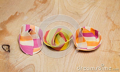 Three colorful ravioli on a wooden board Stock Photo