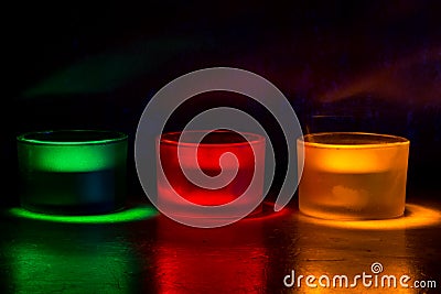 Three coloured candles Stock Photo