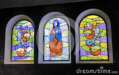 Three colourful stained glass windows Stock Photo