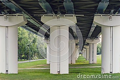 Three columns of the metro bridge, bottom view Stock Photo