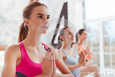 Three concentrated women having yoga classes Stock Photo