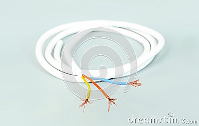 Three-core cable in white isolation on a gray background Stock Photo