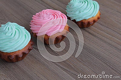 Three cream cakes of different colors. Stock Photo