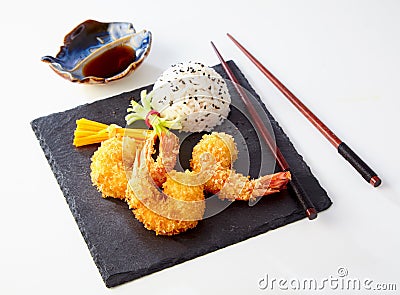 Three crispy Japanese tempura batter prawns Stock Photo
