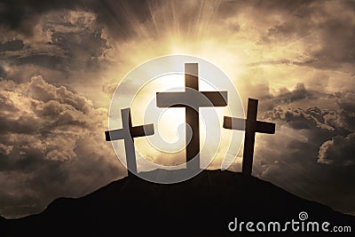 Three crosses symbol on mountain peak Stock Photo