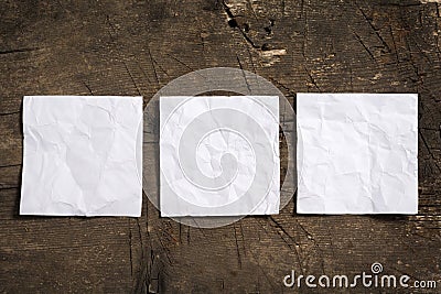 Three crumpled blank white note papers in a row Stock Photo