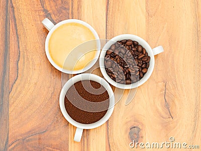 Three cups with coffee, coffee beans and ground coffee Stock Photo