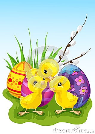 Three cute chickens in front of Easter eggs Stock Photo