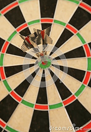 Three darts in bullseye Stock Photo