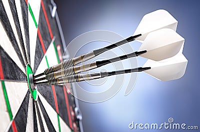 Three darts in bullseye Stock Photo