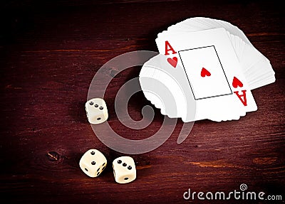 Three dice near playing card, poker game texas Stock Photo