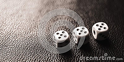 Three dices on the black table. BW photo Stock Photo