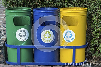 Three different container in a park for more clean planet, outddor, recycle icons Stock Photo