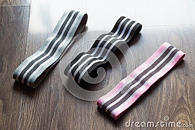 Three different level resistance bands. Pink, black and gray resistance bands Stock Photo