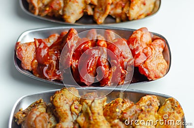 Three different set of the chicken wings with sriracha glaze, Caribbean marinade and Chinese glaze Stock Photo