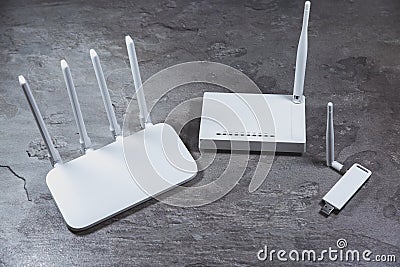 Three different types of Wi-Fi routers, modern and old technology. Wireless ethernet connection signal Stock Photo