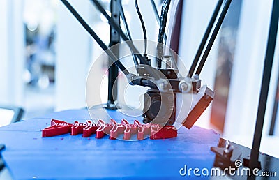 three dimensional 3D printer machine printing plastic model of fish skeleton Stock Photo