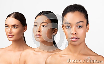 Three Diverse Young Women Posing On White Background, Studio Shot Stock Photo
