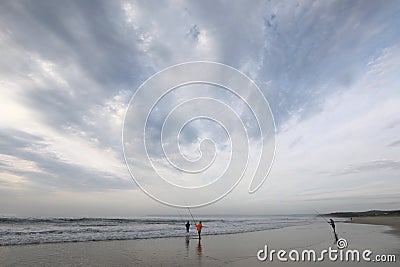 Three early fishermen in action Editorial Stock Photo