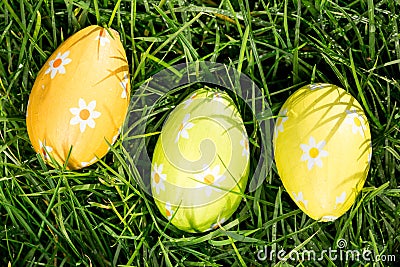 Three easter eggs nestled in the grass Stock Photo