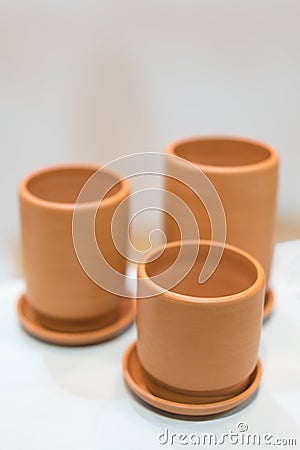 Three empty clay cups Stock Photo