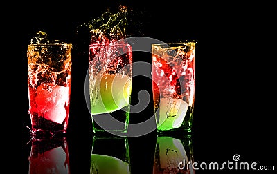 Three exotic tropical cocktails on a black backgro Stock Photo