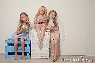 Three girls girlfriend eat candy lollipop sister Stock Photo