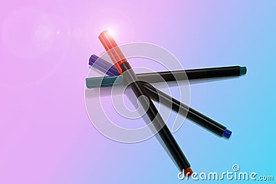 Three felt-tip markers on pastel blue an pink background Stock Photo