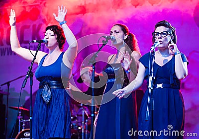 Three female choristers singing Editorial Stock Photo