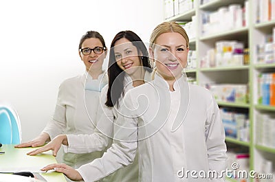 Three female pharmacists on work Stock Photo