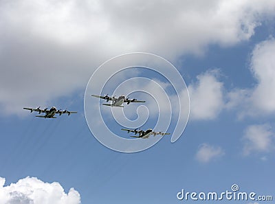 Three four-engine turboprop airplanes Stock Photo