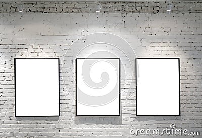 Three frames on brick wall Stock Photo