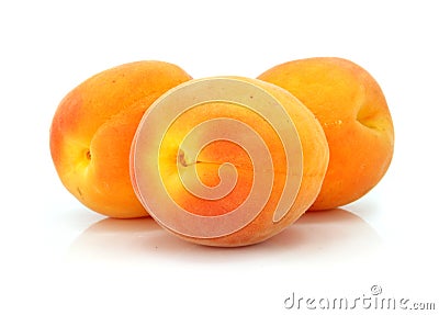 Three fresh apricot fruits isolated Stock Photo