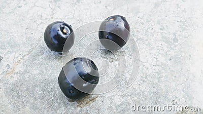 Three fresh jamun fruits or Indian BlackBerry fruits Stock Photo