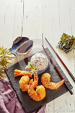 Three fried Japanese tempura shrimp tails Stock Photo