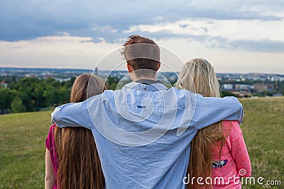 Three friend looking at the city panorama. Stock Photo