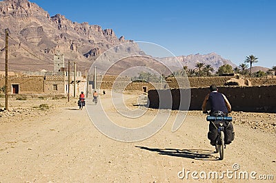 Three friends cycling in south Morocco Stock Photo