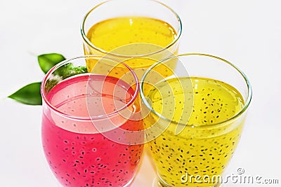 Three fruit drinks in pastel colors with basil seed Stock Photo