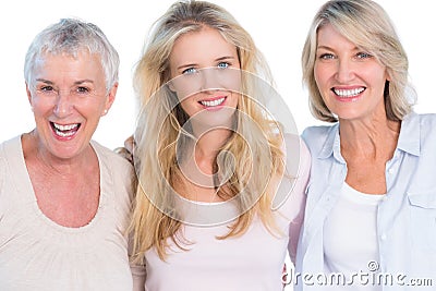Three generations of cheerful women smiling at camera Stock Photo