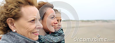 Three generations female looking at sea Stock Photo