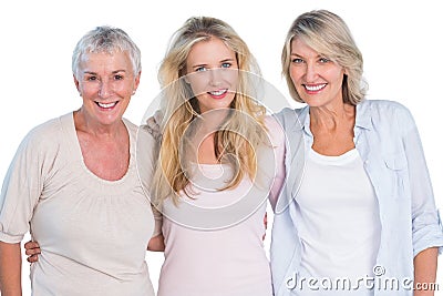 Three generations of happy women smiling at camera Stock Photo