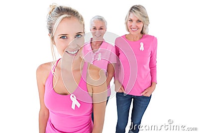 Three generations of women wearing pink tops and breast cancer r Stock Photo