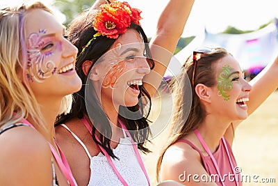 Three girl friends at a music festival Stock Photo