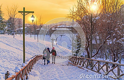 Three girls walk on a pathway between wooden fence in Altinkoy Ankara/Turkey Editorial Stock Photo