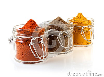 Three glass jars filled with spices Stock Photo