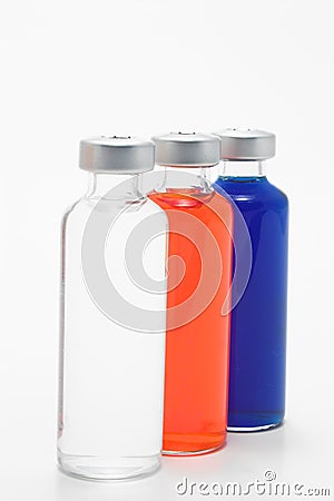 Three Glass Vials with Liquids Stock Photo