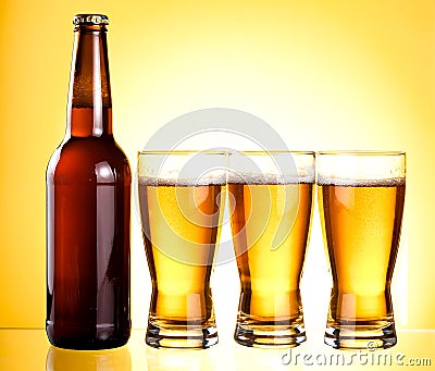 Three glasses and Bottle of fresh light beer Stock Photo